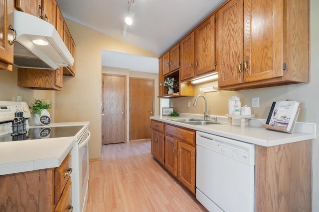 1603 Maplewood Dr, Little Chute, WI 54140 - kitchen with white appliances, under cabinet range hood, a sink, vaulted ceiling, and light wood-style floors