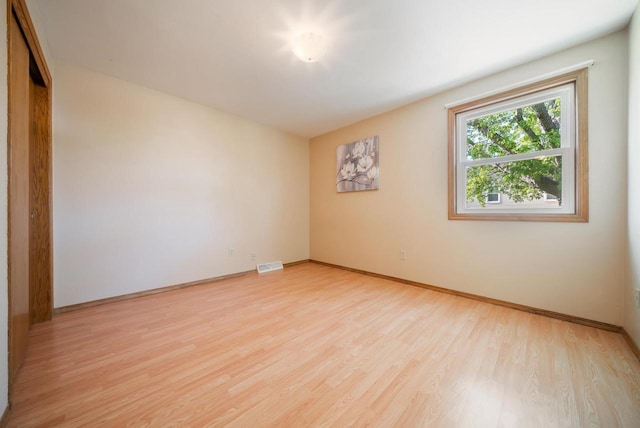 1603 Maplewood Dr, Little Chute, WI 54140 - spare room featuring light wood finished floors and baseboards