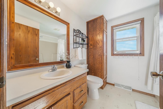 1603 Maplewood Dr, Little Chute, WI 54140 - full bathroom featuring toilet, vanity, tile patterned floors, baseboards, and a shower with shower curtain