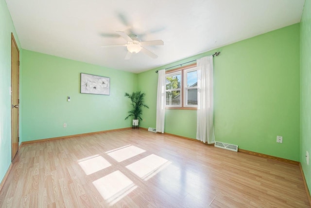 1603 Maplewood Dr, Little Chute, WI 54140 - spare room with a ceiling fan, light wood-style floors, and baseboards