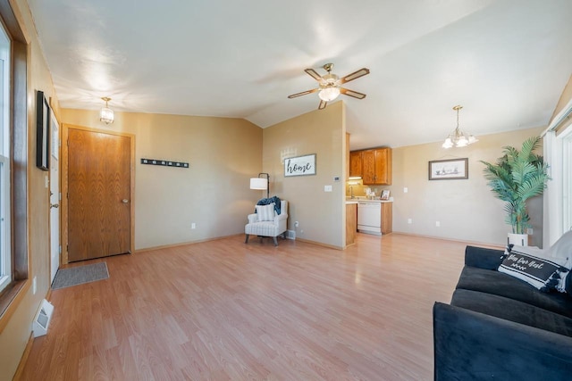 1603 Maplewood Dr, Little Chute, WI 54140 - living area featuring lofted ceiling, light wood-type flooring, ceiling fan, and baseboards