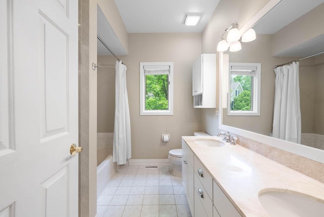 1261 Deer Ct, Lake Geneva, WI 53147 - full bathroom featuring plenty of natural light, double vanity, shower / bath combo, and toilet
