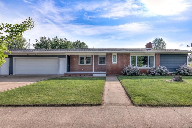 2706 Nimitz St, Eau Claire, WI 54701 - single story home featuring an attached garage, driveway, brick siding, and a front lawn