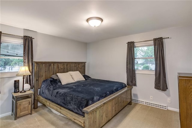 2706 Nimitz St, Eau Claire, WI 54701 - bedroom featuring baseboard heating, light colored carpet, and baseboards