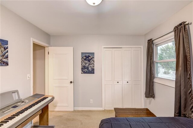 2706 Nimitz St, Eau Claire, WI 54701 - bedroom with light colored carpet, a closet, and baseboards
