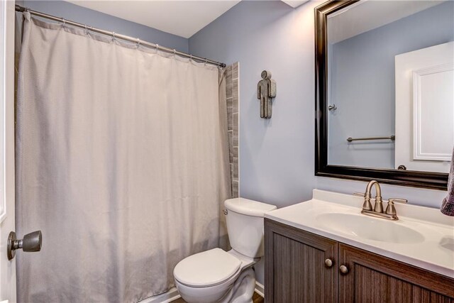 2706 Nimitz St, Eau Claire, WI 54701 - full bathroom with toilet, vanity, and a shower with curtain