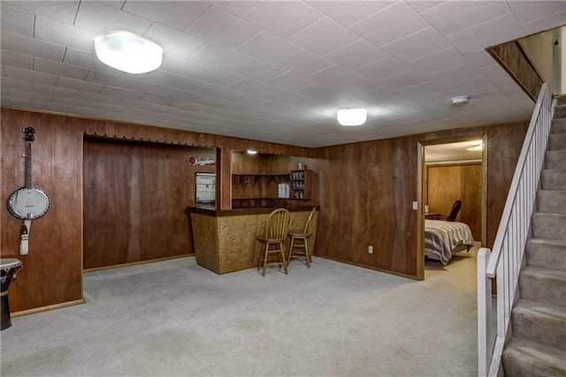 2706 Nimitz St, Eau Claire, WI 54701 - indoor dry bar featuring wood walls, carpet, and stairway