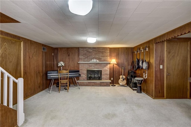 2706 Nimitz St, Eau Claire, WI 54701 - living room featuring wooden walls, carpet floors, and a brick fireplace