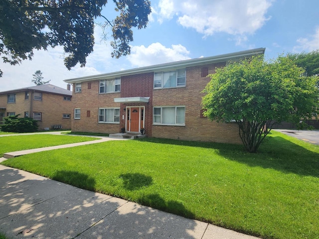 5855 N 83rd St, Milwaukee, WI 53218 - view of front facade featuring a front lawn and brick siding