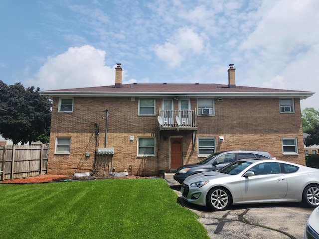 5855 N 83rd St, Milwaukee, WI 53218 - rear view of house featuring brick siding, a chimney, cooling unit, and a balcony