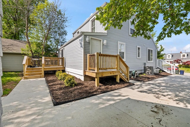 1514 S 96th St, West Allis, WI 53214 - rear view of house featuring a deck and cooling unit