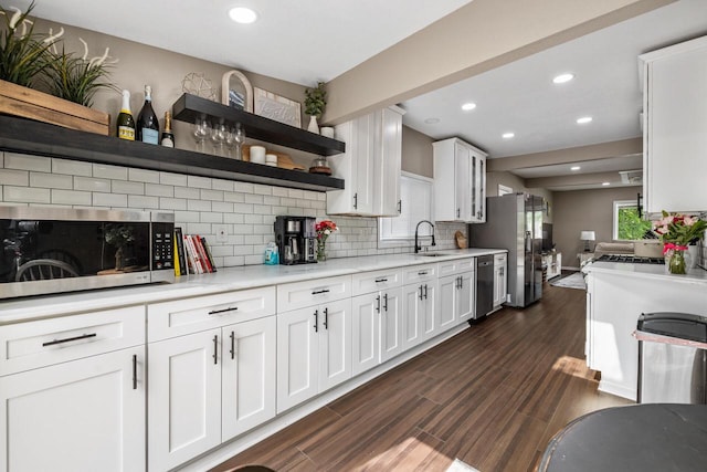 1514 S 96th St, West Allis, WI 53214 - kitchen featuring open shelves, appliances with stainless steel finishes, decorative backsplash, white cabinets, and dark wood finished floors