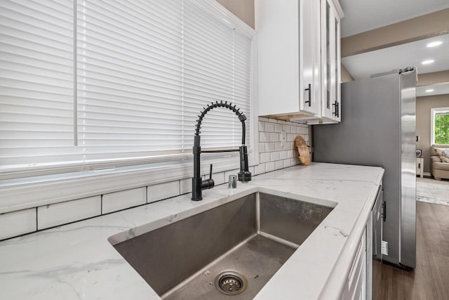 1514 S 96th St, West Allis, WI 53214 - kitchen with a sink, white cabinetry, backsplash, dark wood-type flooring, and recessed lighting