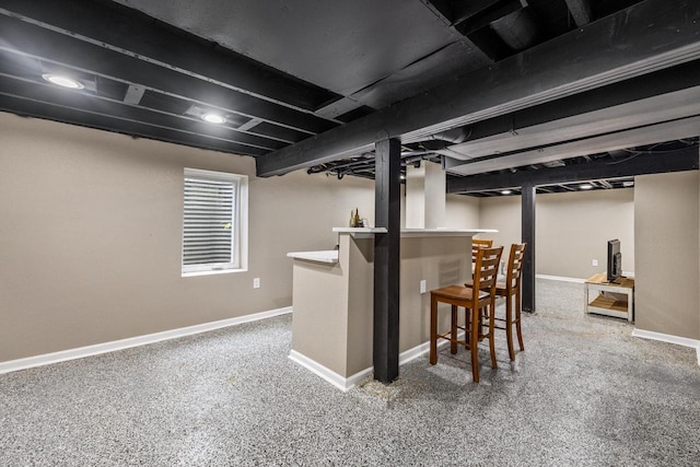 1514 S 96th St, West Allis, WI 53214 - basement featuring baseboards, a bar, and carpet floors