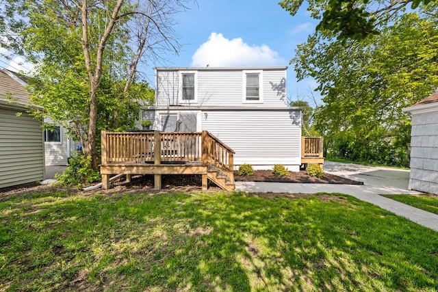 1514 S 96th St, West Allis, WI 53214 - rear view of house featuring a deck and a lawn