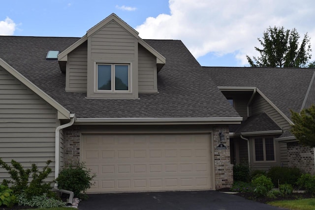 W240N2151 Dorchester Dr Unit 7C, Pewaukee, WI 53072 - view of front of property with a shingled roof and driveway