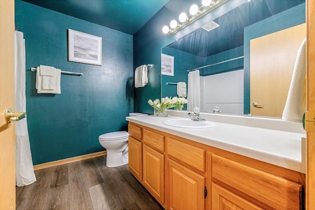 1972 Parknoll Ln, Port Washington, WI 53074 - bathroom with wood finished floors, vanity, toilet, curtained shower, and baseboards
