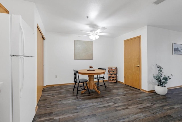 1972 Parknoll Ln, Port Washington, WI 53074 - dining room featuring dark wood-style floors, a ceiling fan, and baseboards
