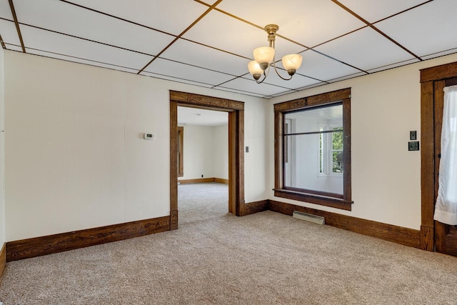 103 First St, Ontario, WI 54651 - carpeted empty room featuring baseboards and a chandelier