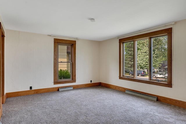 103 First St, Ontario, WI 54651 - empty room with a baseboard heating unit, carpet flooring, and baseboards