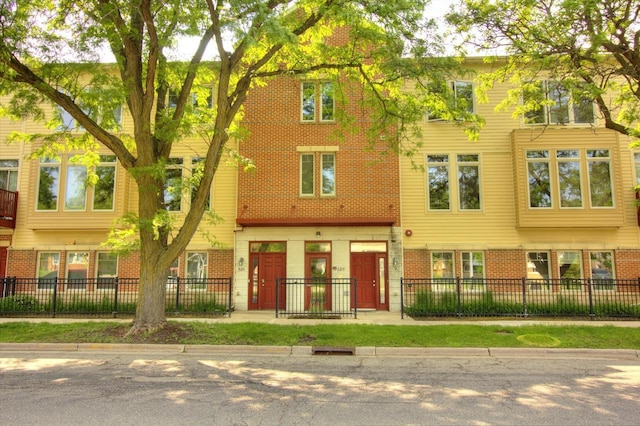 688 N Midvale Blvd Unit 201, Madison, WI 53705 - multi unit property with brick siding and a fenced front yard