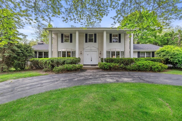 15075 Kings Ridge Ct, Brookfield, WI 53005 - greek revival house with a front yard and stucco siding