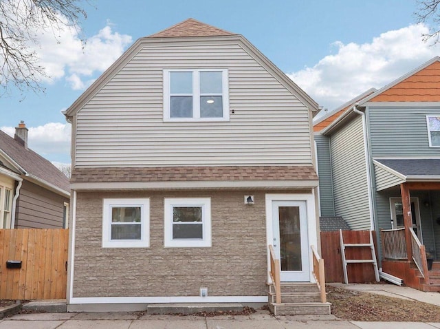 2533 S Austin St, Milwaukee, WI 53207 - rear view of house featuring a shingled roof and entry steps