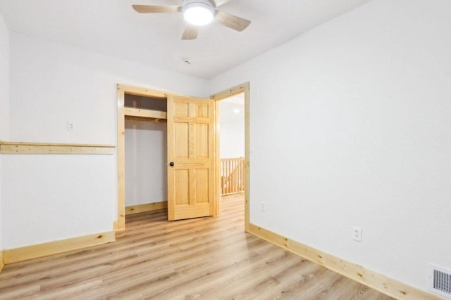 2533 S Austin St, Milwaukee, WI 53207 - unfurnished bedroom featuring light wood finished floors, baseboards, ceiling fan, and a closet