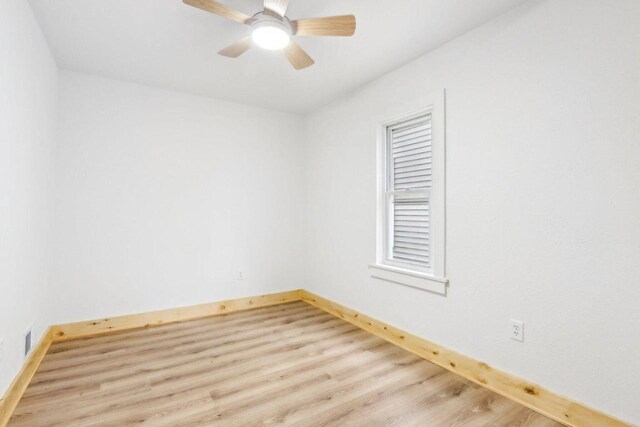 2533 S Austin St, Milwaukee, WI 53207 - unfurnished room with baseboards, wood finished floors, and a ceiling fan