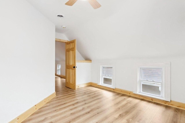 2533 S Austin St, Milwaukee, WI 53207 - additional living space with lofted ceiling, light wood finished floors, baseboards, and a ceiling fan