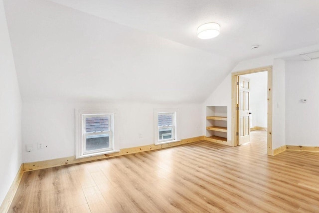 2533 S Austin St, Milwaukee, WI 53207 - bonus room with light wood-style floors, vaulted ceiling, and baseboards