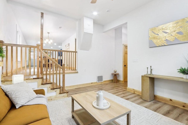 2533 S Austin St, Milwaukee, WI 53207 - living area featuring wood finished floors, a ceiling fan, baseboards, a chandelier, and recessed lighting