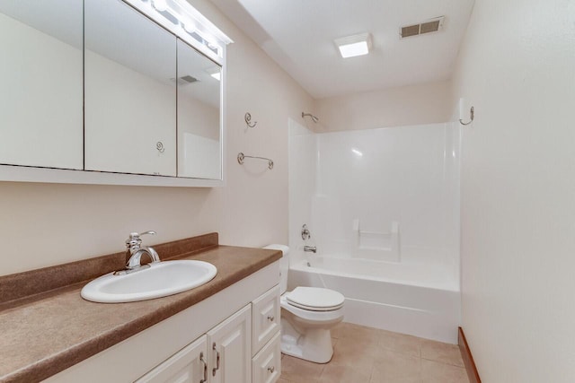 3104 Macharley Ln, La Crosse, WI 54601 - bathroom featuring vanity, tile patterned flooring, toilet, and bathing tub / shower combination