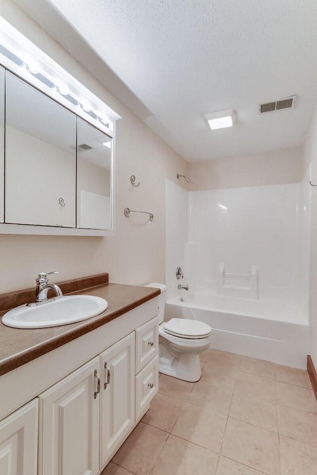 3104 Macharley Ln, La Crosse, WI 54601 - bathroom with shower / bathtub combination, vanity, tile patterned floors, toilet, and a textured ceiling