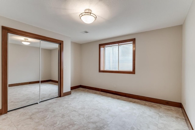 3104 Macharley Ln, La Crosse, WI 54601 - unfurnished bedroom featuring a closet and baseboards