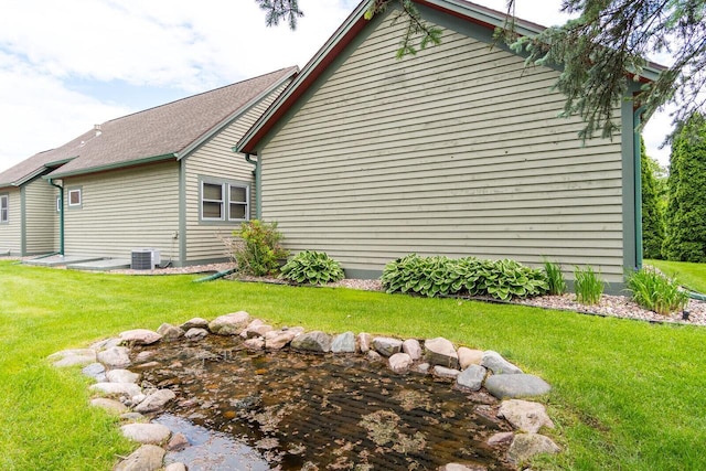 3104 Macharley Ln, La Crosse, WI 54601 - rear view of house featuring a lawn and central AC