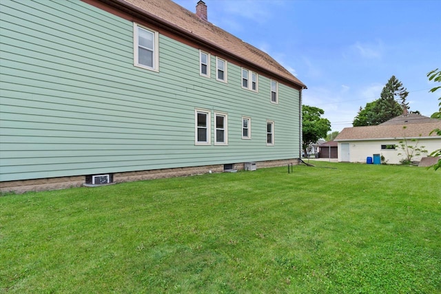 3700 E Hammond Ave, Cudahy, WI 53110 - back of property featuring a lawn and a chimney