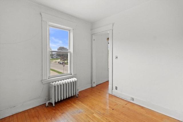 3700 E Hammond Ave, Cudahy, WI 53110 - unfurnished room with radiator and light wood-style floors