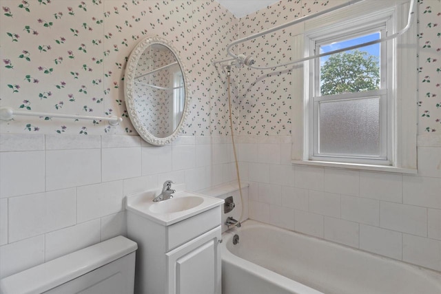 3700 E Hammond Ave, Cudahy, WI 53110 - bathroom featuring wallpapered walls, toilet, vanity, and tub / shower combination