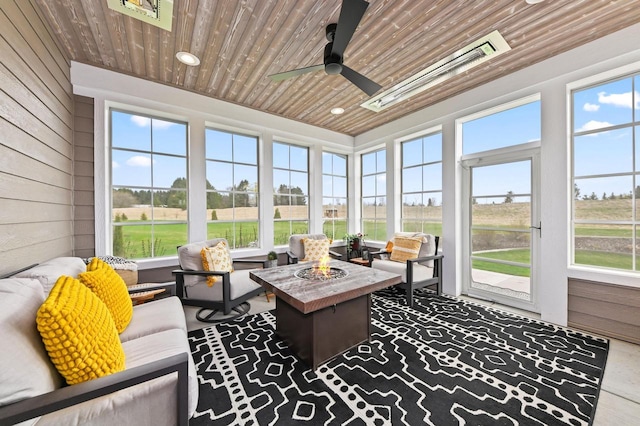 N56W27213 Crispin Ct, Lisbon, WI 53089 - sunroom / solarium featuring ceiling fan and an outdoor living space with a fire pit
