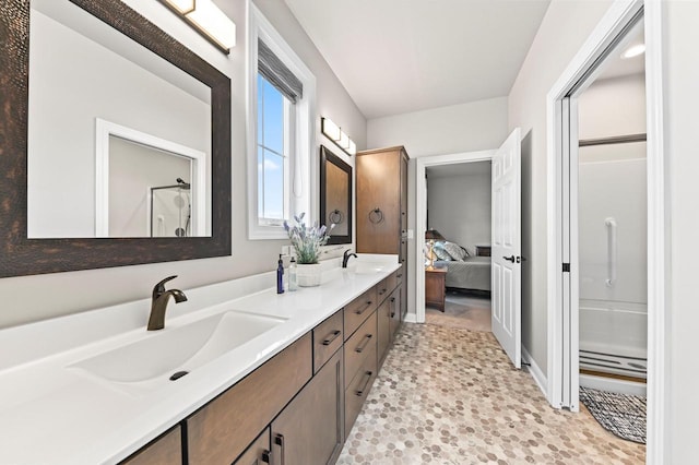 N56W27213 Crispin Ct, Lisbon, WI 53089 - bathroom with double vanity, a stall shower, and ensuite bath