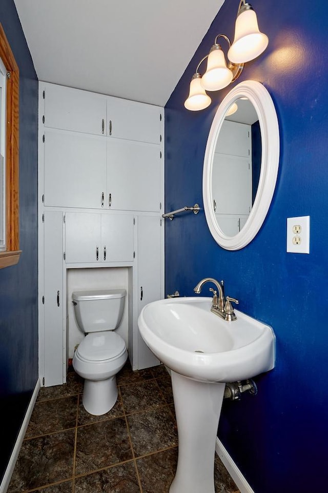 3573 S 94th St, Milwaukee, WI 53228 - bathroom featuring baseboards and toilet