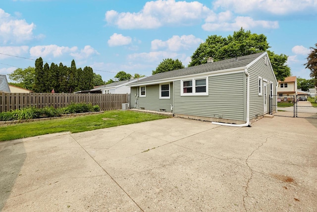 3573 S 94th St, Milwaukee, WI 53228 - back of house with a patio area and roof with shingles