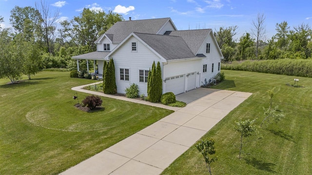 5119 Reynolds Ave, Waunakee, WI 53597 - view of property exterior featuring concrete driveway, a lawn, and a shingled roof