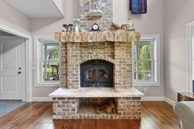 5119 Reynolds Ave, Waunakee, WI 53597 - living room featuring hardwood / wood-style floors, baseboards, and a fireplace