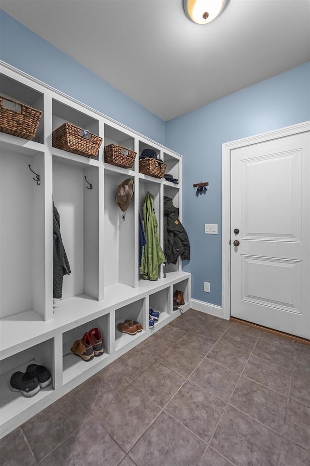 5119 Reynolds Ave, Waunakee, WI 53597 - mudroom featuring dark tile patterned flooring and baseboards