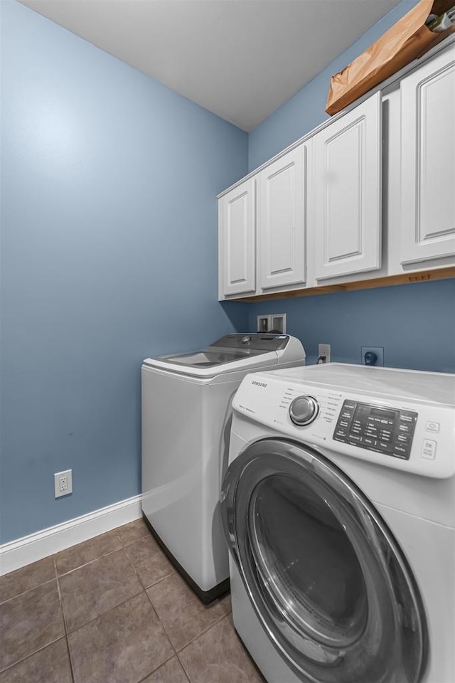 5119 Reynolds Ave, Waunakee, WI 53597 - laundry room featuring cabinet space, washing machine and dryer, baseboards, and tile patterned floors