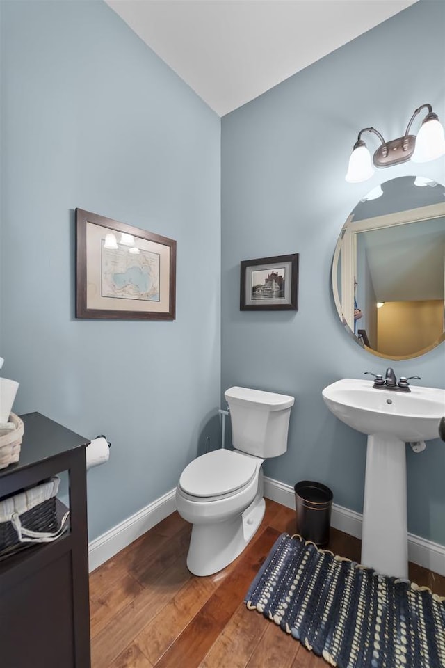 5119 Reynolds Ave, Waunakee, WI 53597 - bathroom with wood finished floors, baseboards, toilet, and a sink