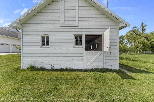 5119 Reynolds Ave, Waunakee, WI 53597 - view of property exterior featuring a lawn and an outbuilding