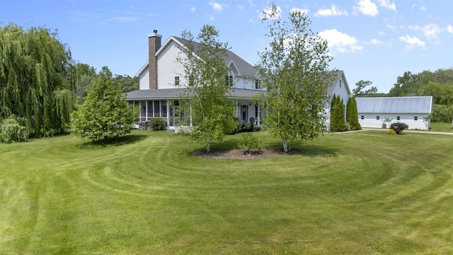 5119 Reynolds Ave, Waunakee, WI 53597 - view of front of home featuring a chimney, a front lawn, and roof with shingles